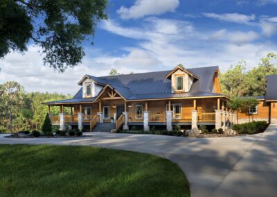 Rustic log cabin surrounded by trees and sky.