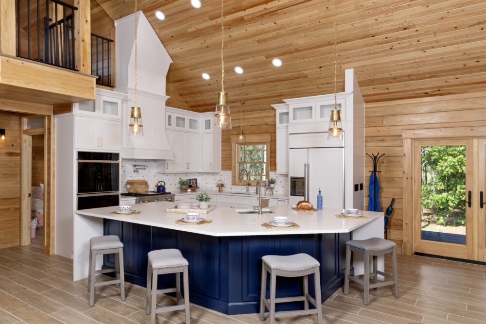 9S8A7107 Modern kitchen with wooden accents and island seating.