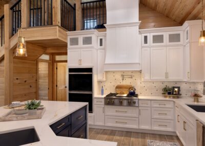 Modern kitchen with white cabinets and wood accents.