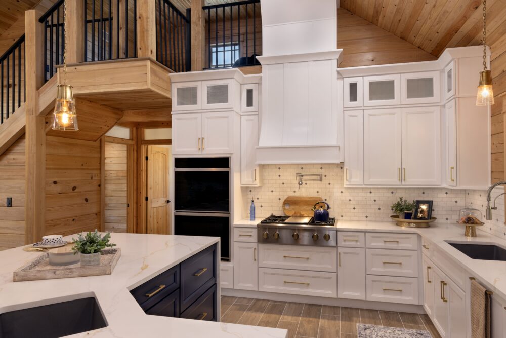 9S8A7143 Modern kitchen with white cabinets and wood accents.