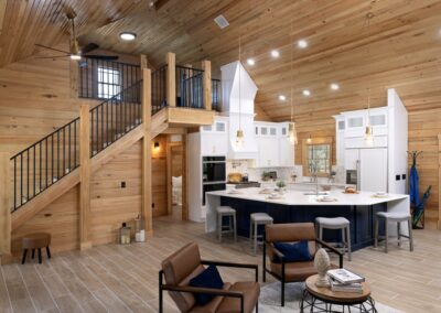 Rustic modern kitchen with wooden ceiling and island.