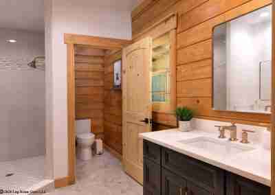 Rustic bathroom with wooden accents and modern fixtures.