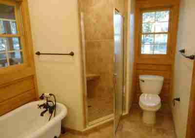 Clean bathroom featuring a shower and bathtub.