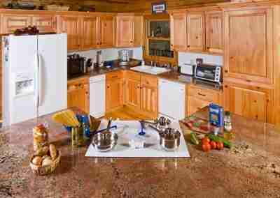 Cozy wooden kitchen with cooking supplies and ingredients.