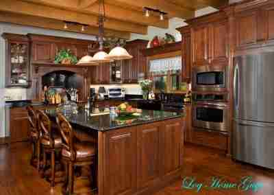 Elegant wooden kitchen with dark countertops and appliances.