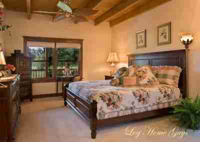 Cozy log cabin bedroom with floral decor