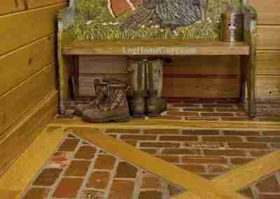 Rustic bench with turkey design and boots.