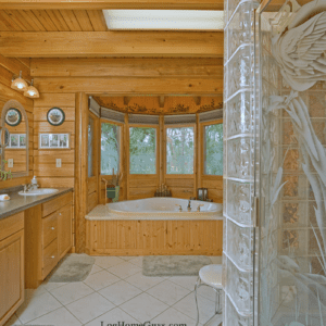 Shenandoah Log home floor plan features a architectural alcove in master bath for a large garden bathtub. Designed by Log Home Guys