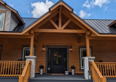 Wooden house entrance with welcoming sign