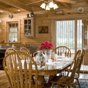 Silverado log home kitchen and dining area by Log Home Guys