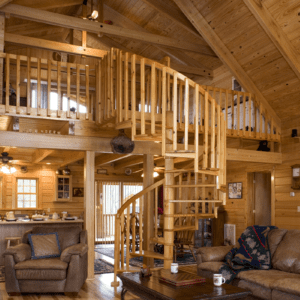 Silverado log home plan features a cozy loft accessed by a beautiful spiral staircase.